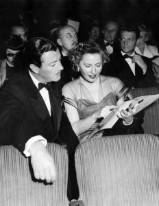Barbara Stanwyck and her movie star husband, Robert Taylor, at the 1949 Academy Awards. Photo courtesy of the Los Angeles Public Library.